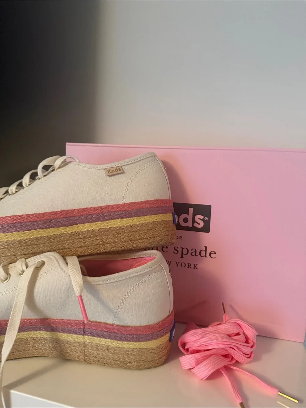 kate spade cream canvas platform sneakers with pink and gold accents